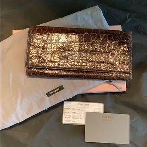 Miu Miu Embossed leather continental brown wallet